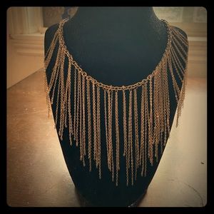 Gold colored drip statement necklace